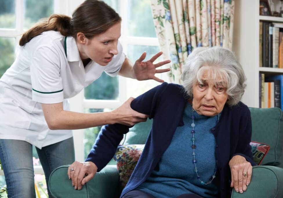Care Worker Mistreating Senior Woman At Home nursing home abuse attorney houston
